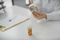 pharmacist working on refill